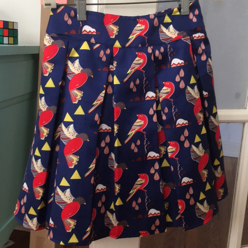 Blue bird pleated mini skirt